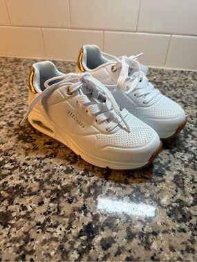 Skechers Kids White Sneakers with Gold Accent
